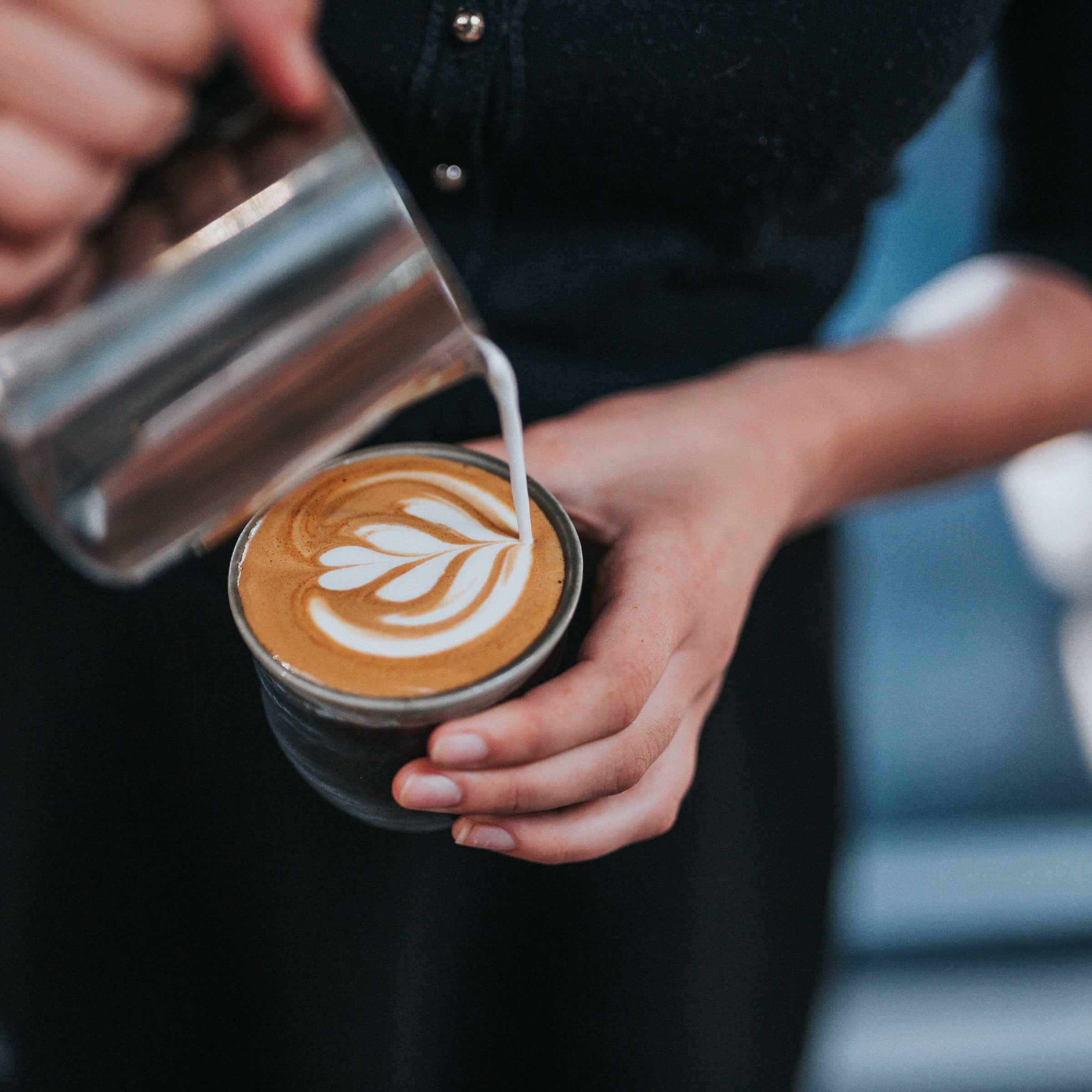 Casul employee making a coffee